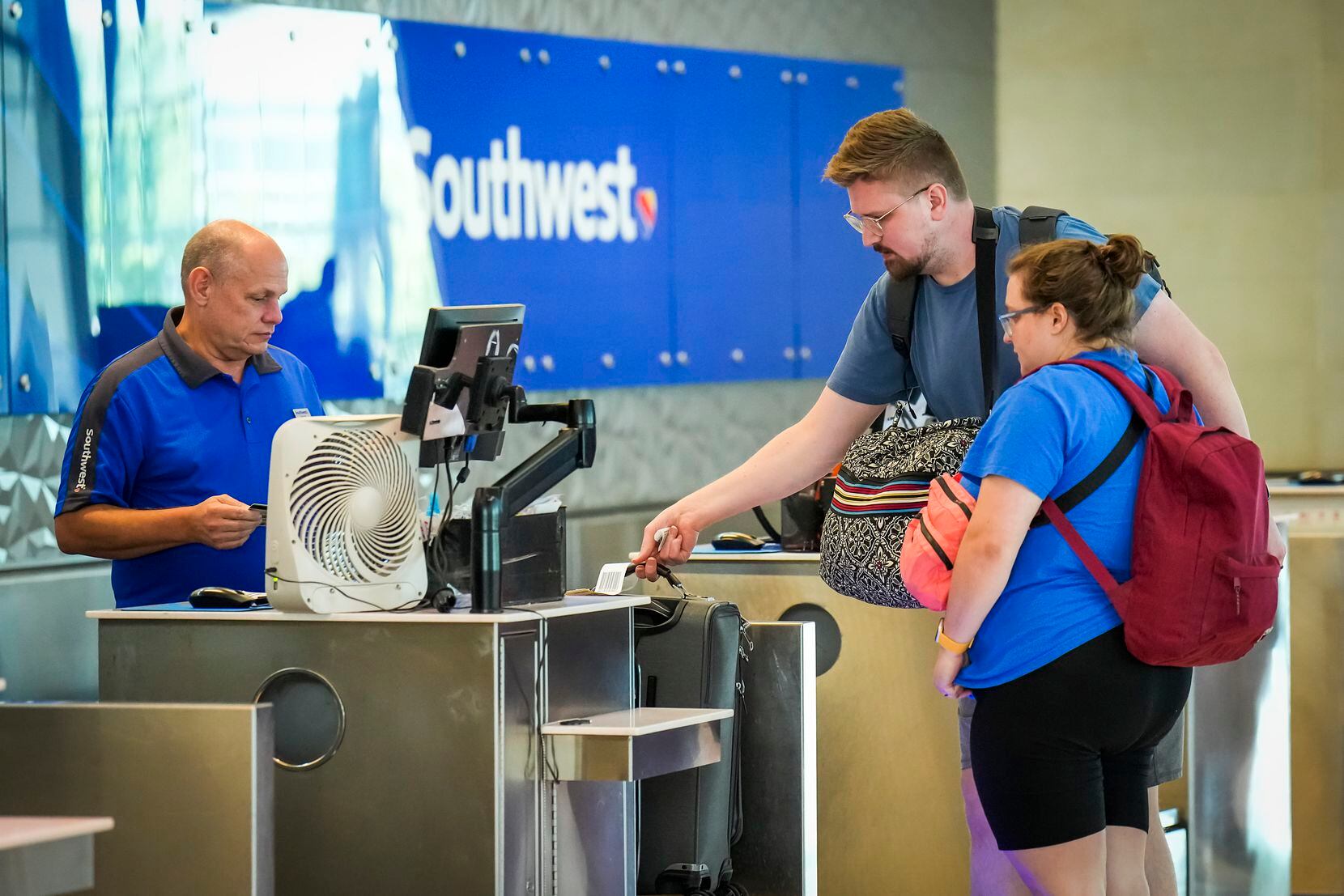 Ellen and Dawson Vosburg checked baggage for a Southwest Airlines flight at Dallas Love...