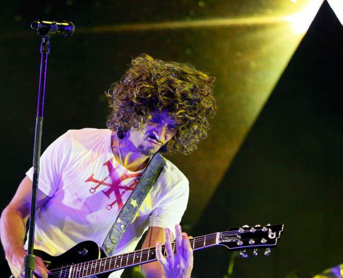 Chris Cornell plays guitar during Soundgarden performance at Gexa Energy Pavilion, Aug. 17,...