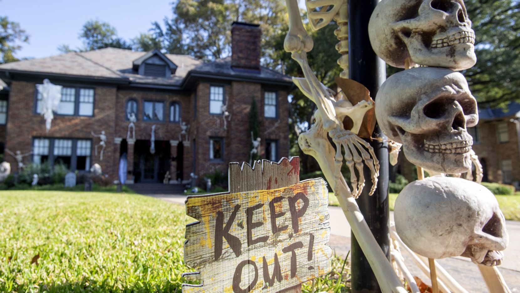 Halloween decorations adorn the front yard of a home on Dallas' Swiss Avenue on Wednesday. ...