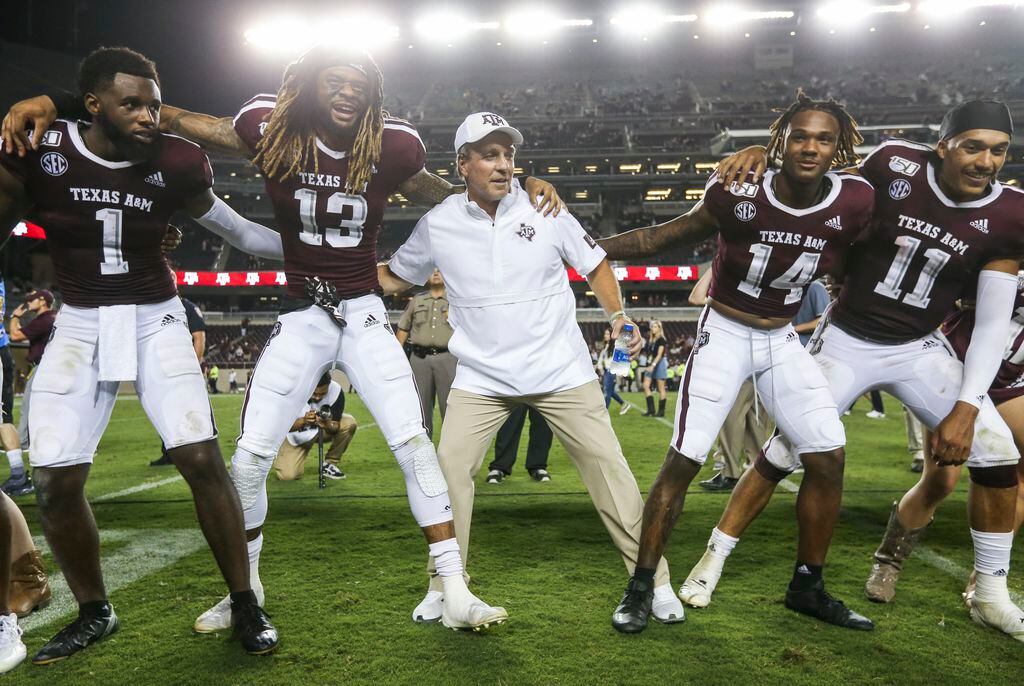 Texas A&M Aggies wide receiver Quartney Davis (1), wide receiver Kendrick Rogers (13), head coach Jimbo Fisher, wide receiver Camron Buckley (14), and quarterback Kellen Mond (11) celebrate following Texas A&M's 41-7 win over Texas State on Thursday, Aug. 29, 2019 at Kyle Field in College Station, Texas. (Ryan Michalesko/The Dallas Morning News)