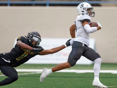 Fort Worth All Saints wide receiver Christopher Palfreeman (8) scores a touchdown on a...