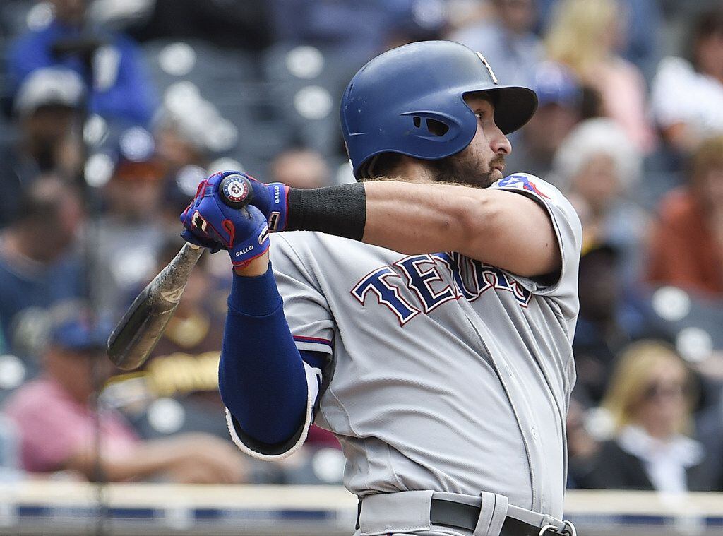SAN DIEGO, CA - MAY 9: Joey Gallo #13 of the Texas Rangers hits an RBI single during the...