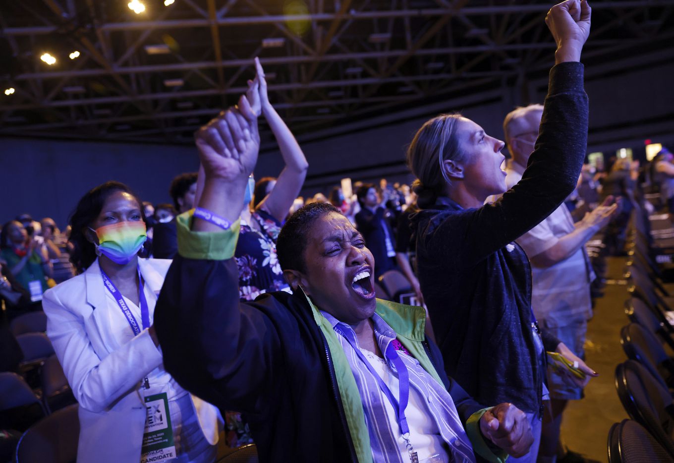 Delegates Hazel Weathers (center) and Sheena King (left) and others cheer U.S....