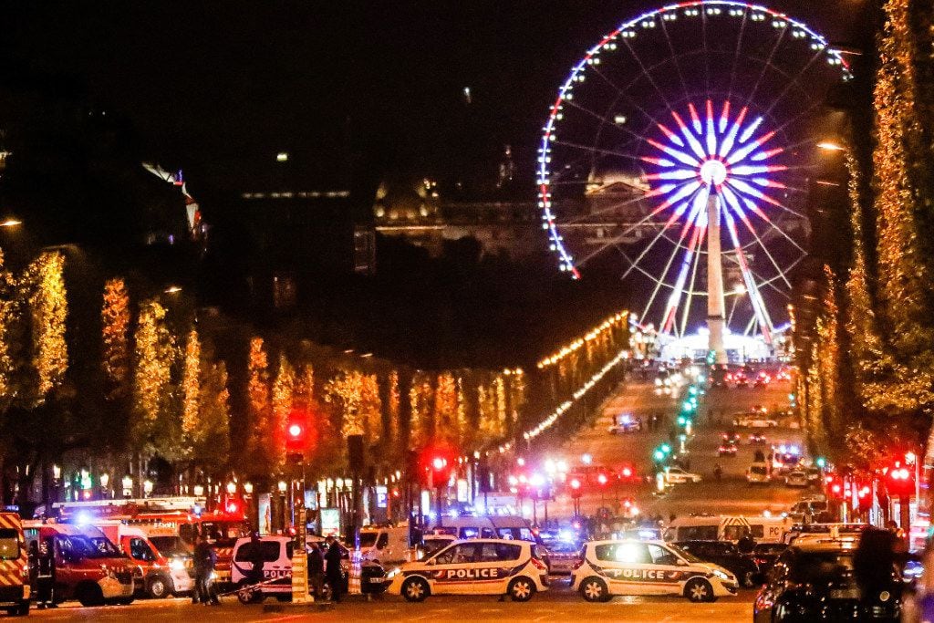 Police secure the Champs Elysees area after one policeman was killed and another wounded in...