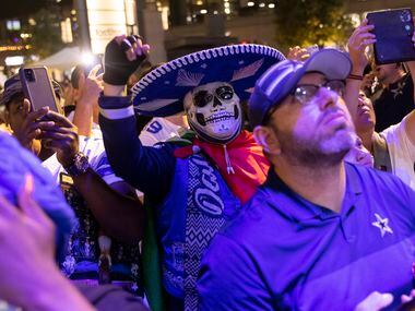 Dallas Cowboys Diego Salas of Mesquite celebrates as former Tulsa OT Tyler Smith is picked...