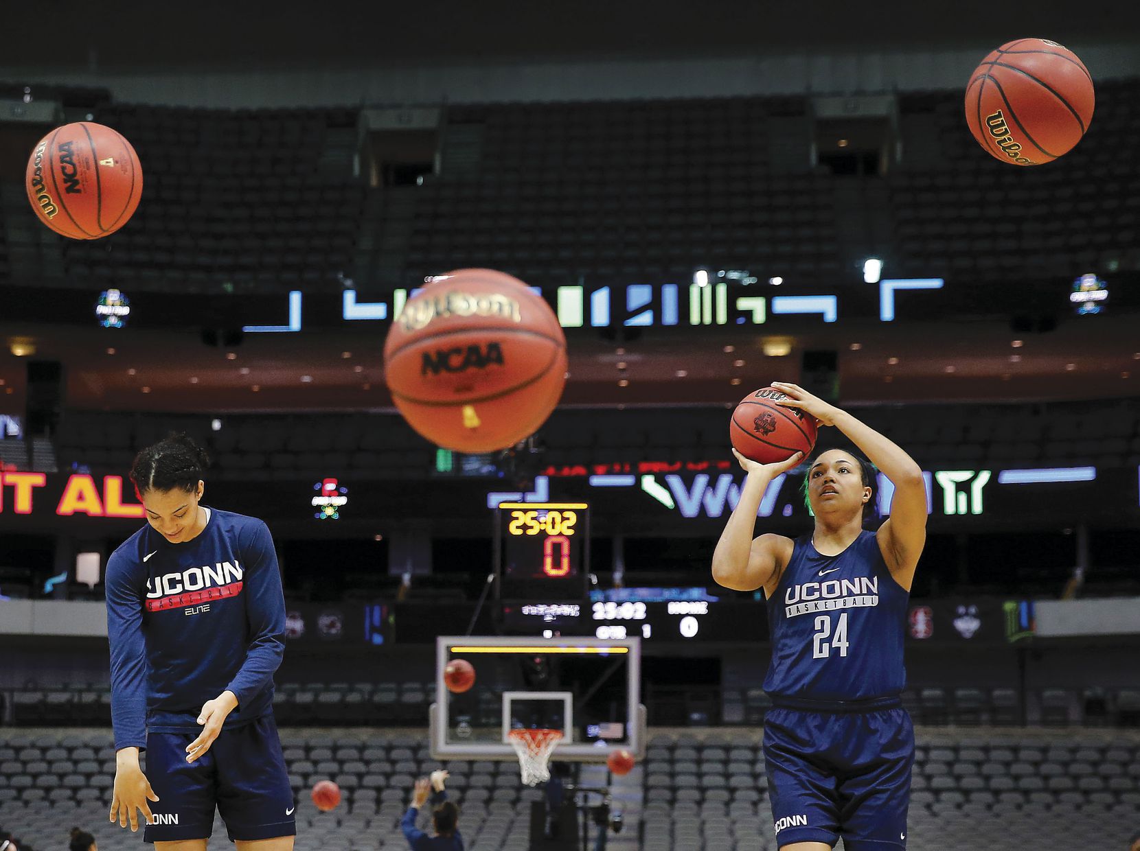 Connecticut Huskies guard/forward Napheesa Collier (right) and teammate Gabby Williams shoot baskets during practice for their NCAA Womenâs Final Four semifinal game at American Airlines Center in Dallas.