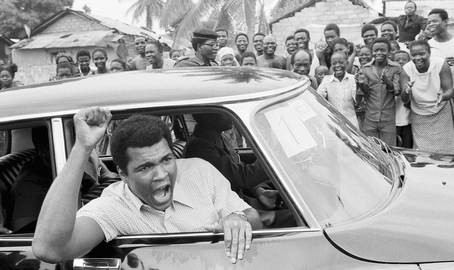This is a Sept. 17, 1974  file photo of Muhammad Ali as he chants to fans during  a...
