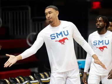Southern Methodist Mustangs forward Tristan Clark (25) receives a hand slap from fans following their win over the South Florida Bulls at Moody Coliseum in University Park, Texas, January 12, 2022.