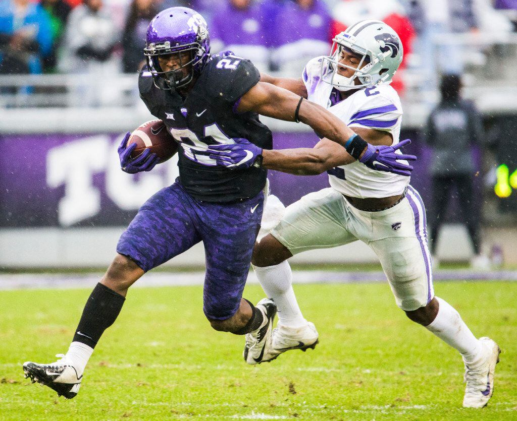 TCU Horned Frogs running back Kyle Hicks (21) is tackled by Kansas State Wildcats defensive...