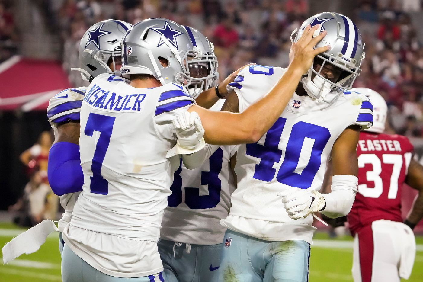 Dallas Cowboys cornerback Nahshon Wright (40) celebrates with punter Hunter Niswander (7) after making a stop on kick coverage during the second half of a preseason NFL football game against the Arizona Cardinals at State Farm Stadium on Friday, Aug. 13, 2021, in Glendale, Ariz.