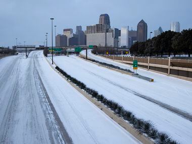 Snow covers US 75 heading into Downtown in Dallas on Monday morning, Feb. 15, 2021. (Juan...