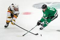 Dallas Stars center Joe Pavelski (16) fights for the puck against Vegas Golden Knights...
