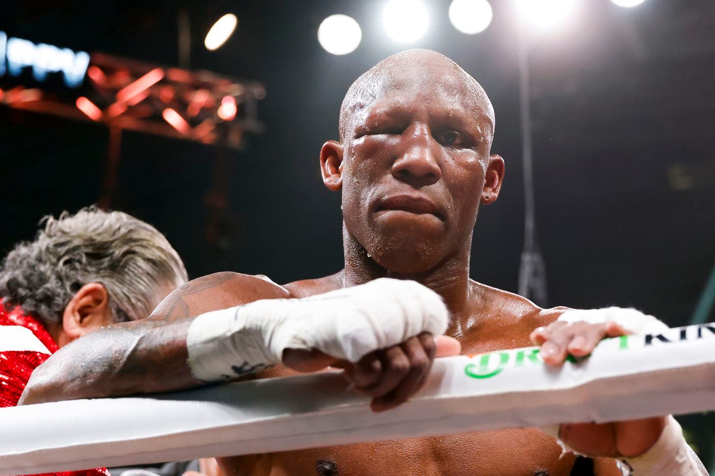 Yordenis Ugas leans over the ring after losing to DeSoto’s Errol Spence Jr. via a technical...