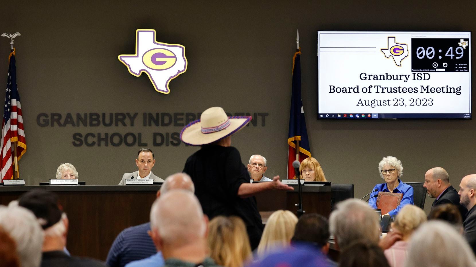 Granbury resident Jodie Gelker, center, speaks during a public comment session of a special...