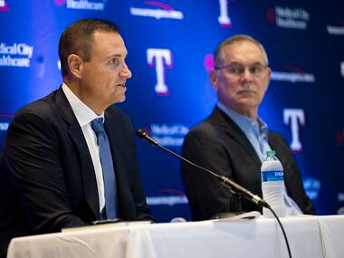 Chris Young (left), the team's executive vice president and general manager, speaks during a...