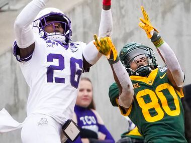 TCU safety Bud Clark (26) intercepts a pass intended for Baylor wide receiver Monaray...