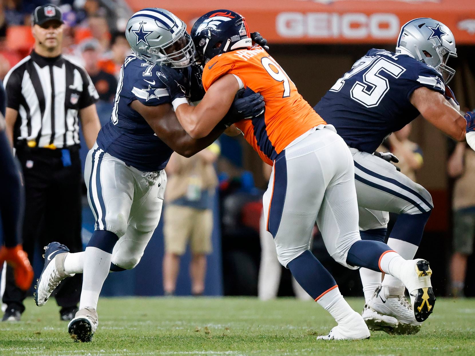 Dallas Cowboys rookie offensive tackle Tyler Smith (73) battles Denver Broncos defensive end...