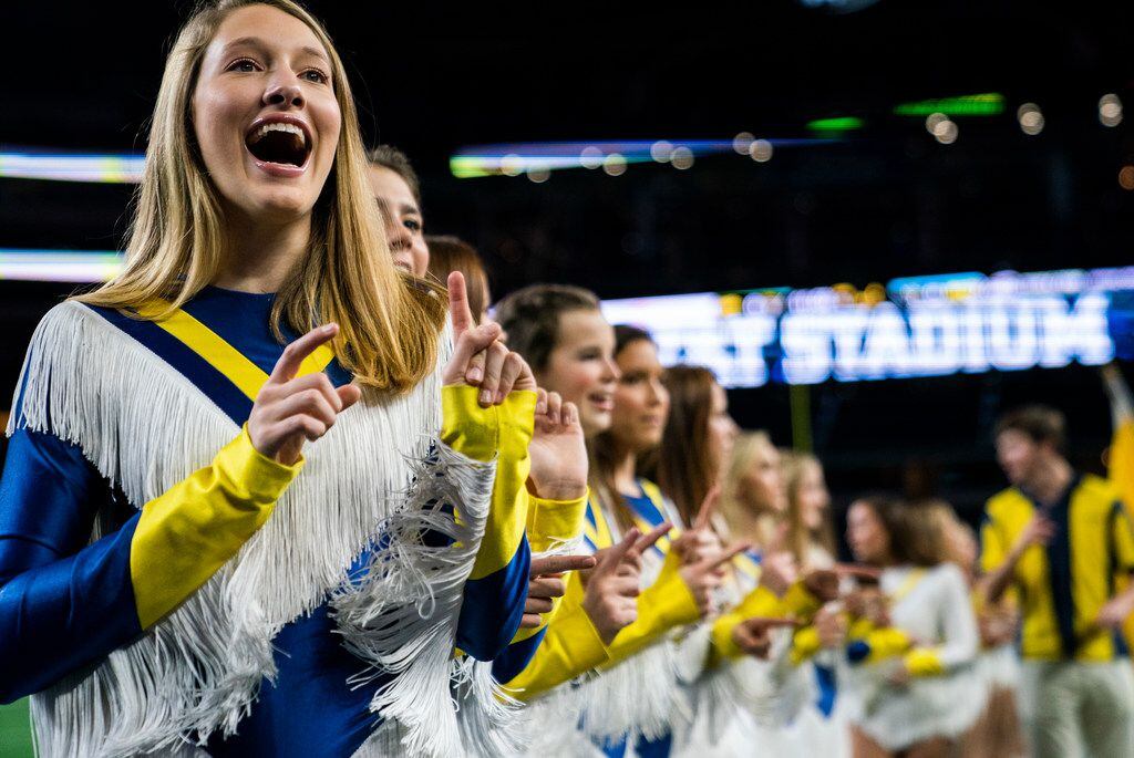 Highland Park dance team members sing the school song before a Class 5A Division I...