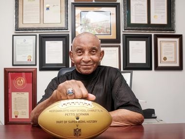 Pettis Norman with his "Golden Wilson," presented to him in 2016 by the NFL as part of its nationwide Super Bowl 50 celebration that featured high school players who went on to play in the Super Bowl. His high school in North Carolina, West Charlotte High School, was also represented by Mo Collins, who played for the Oakland Raiders.