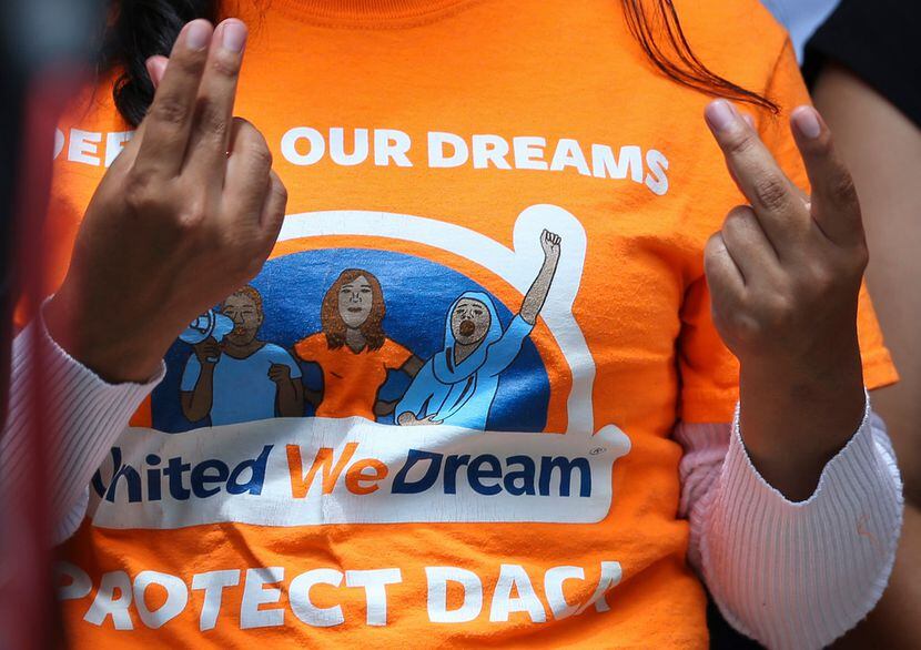 United We Dream youths and allies snap their fingers to show support to other DACA...