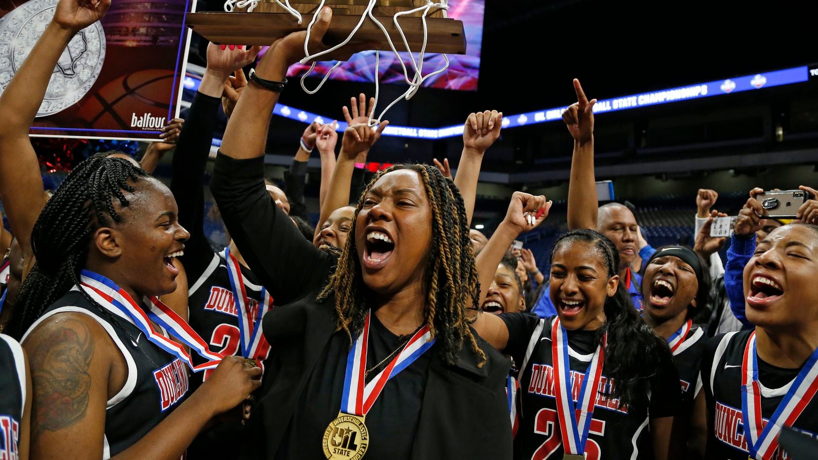 Duncanville head coach LaJeanna Howard holds the Trophy in a 6A final on  Saturday, March 7,...
