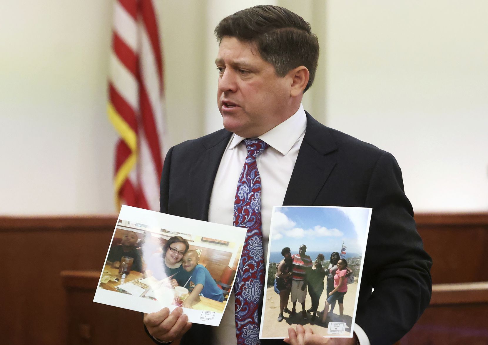 Assistant Tarrant County Criminal District Attorney Dale Smith held photographs of Atatiana...