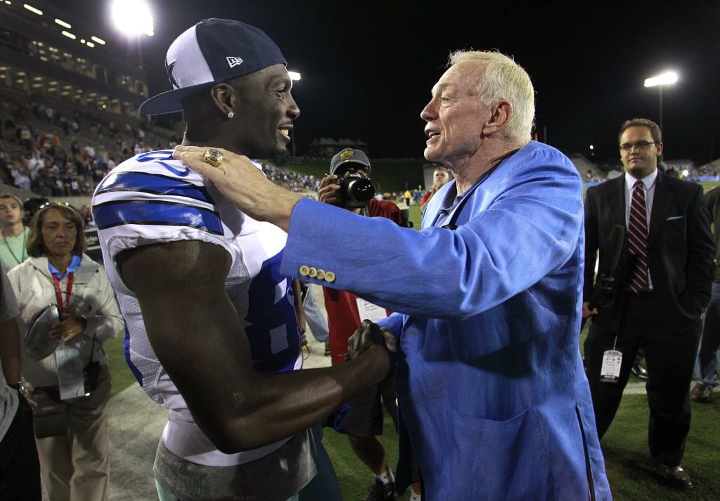 Dallas Cowboys owner Jerry Jones jokingly congratulates wide receiver Dez Bryant on a nice...