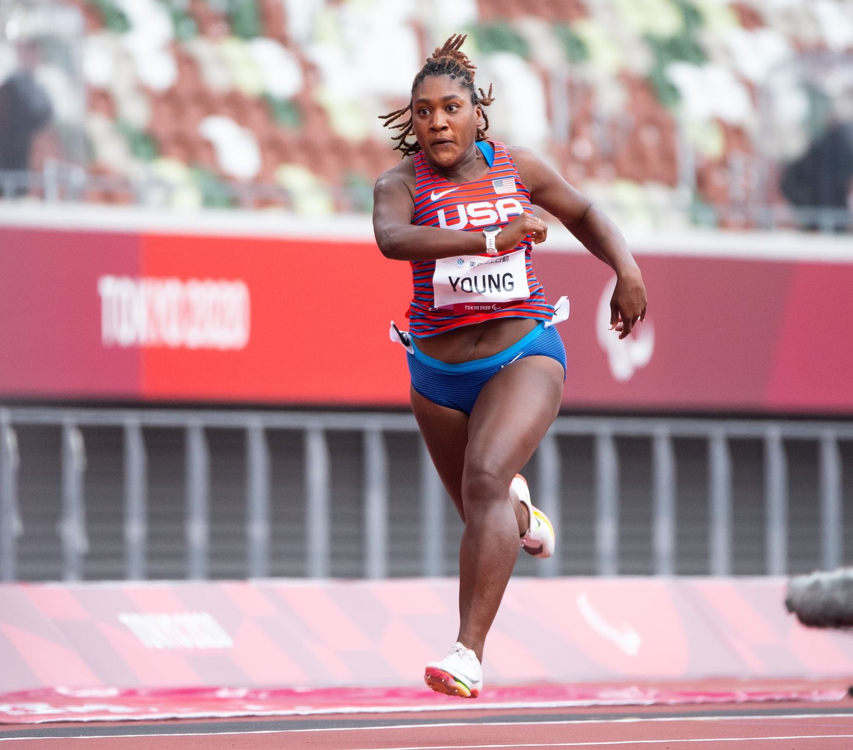 Team USA's Deja Young-Craddock runs in a heat of the 100m August 31, 2021 at the Olympic...
