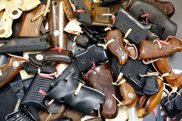 A collection of disassembled guns after they were surrendered during a gun buyback event in...