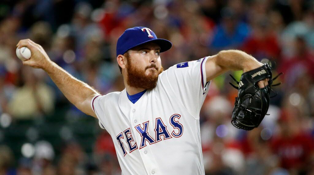 Texas Rangers relief pitcher Sam Dyson throws a pitch against Kansas City Royals during the...