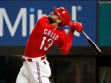 Texas Rangers Joey Gallo watches a fly ball during the ninth inning of a baseball game against the Baltimore Orioles in Arlington, Texas, Friday, April 16, 2021. Texas lost the game 5-2.