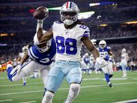Dallas Cowboys wide receiver CeeDee Lamb (88) rolled off a defender and ran the ball in for...