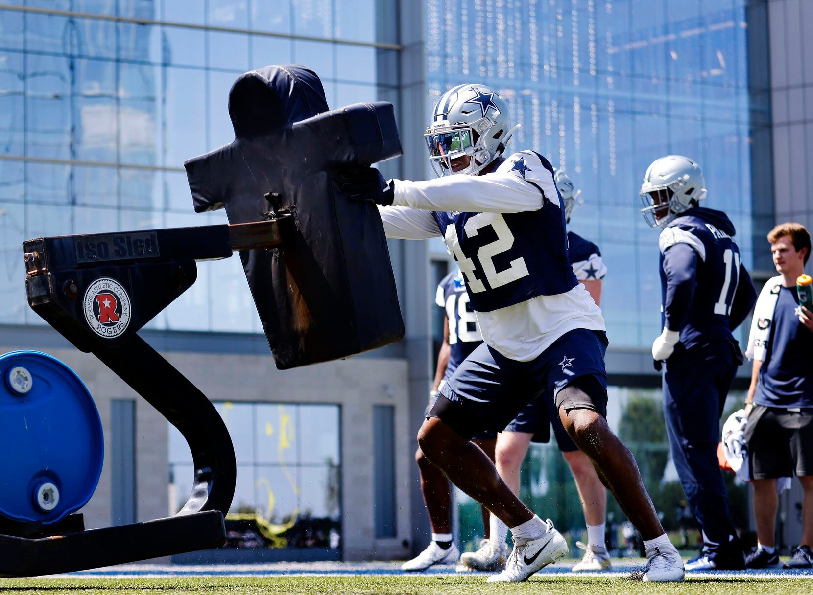 Dallas Cowboys linebacker Keanu Neal (42) hits the blocking dummies during Training Camp...