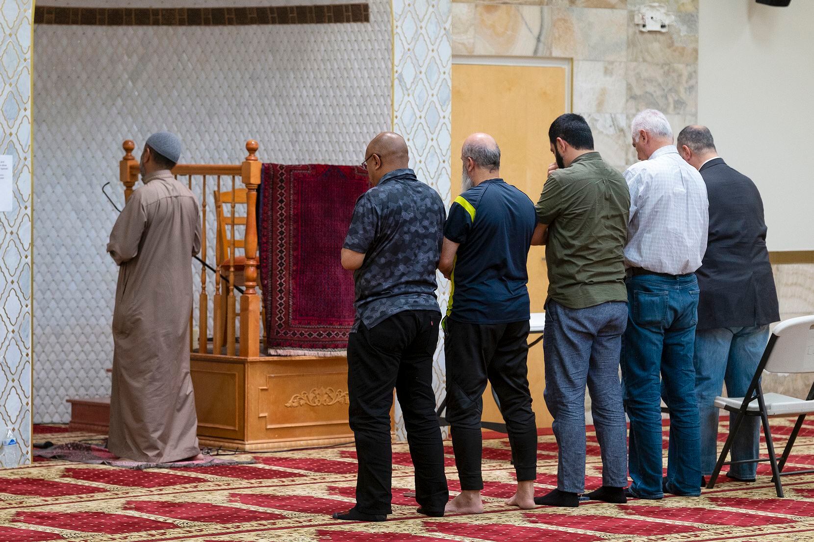An Imam leads a group of men during the Dhuhr afternoon prayer at the Islamic Center of New...