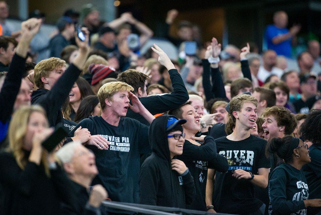 Denton Guyer fans react in disbelief after their team pulls ahead by one point against Cedar...
