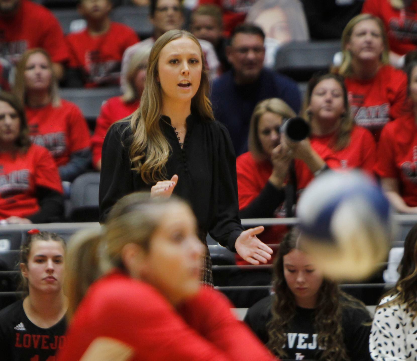 Lucas Lovejoy head coach Natalie Puckett watches the action from 1st set action against...