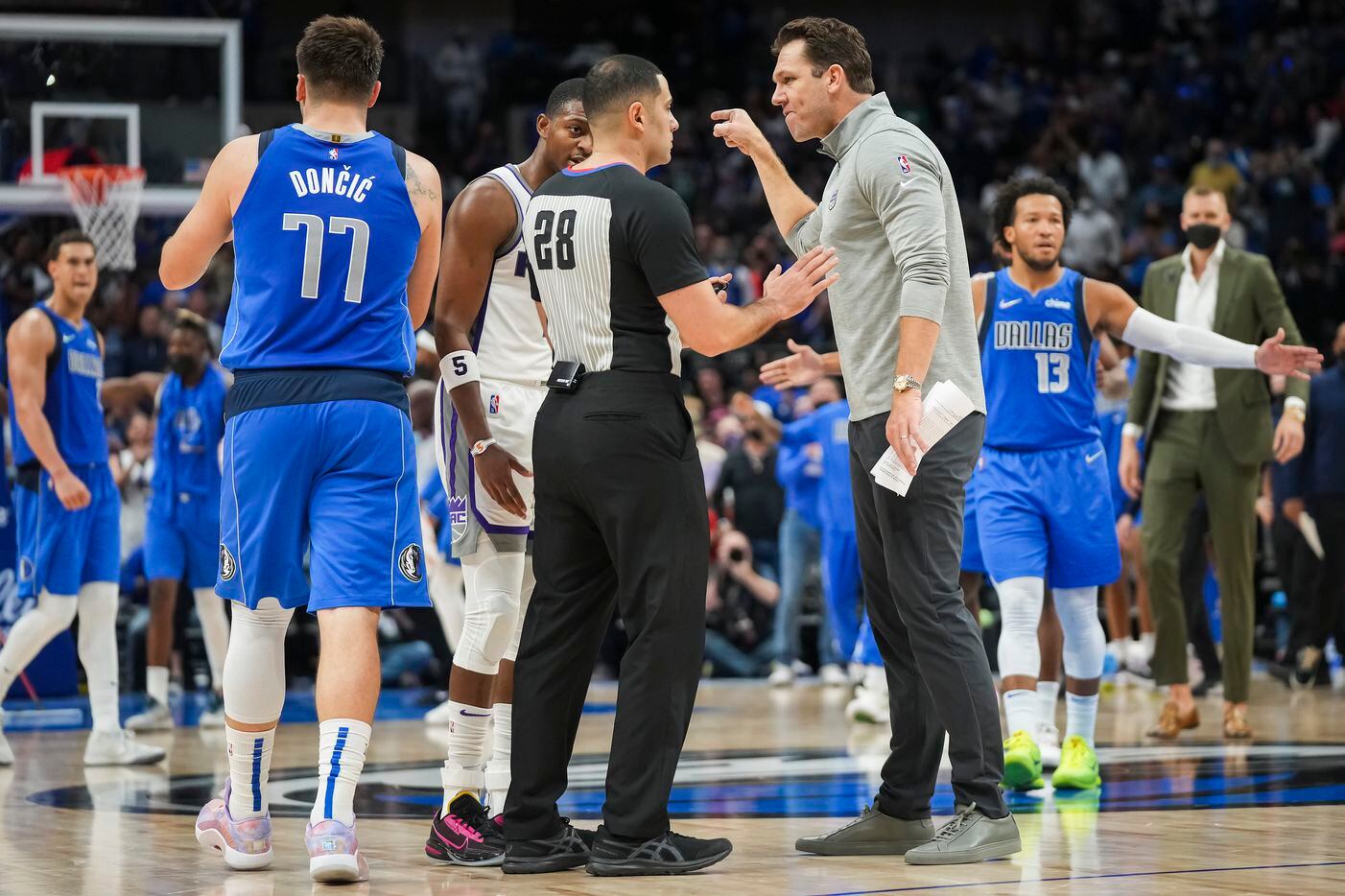 Sacramento Kings head coach Luke Walton argues for a call during the second half of an NBA...
