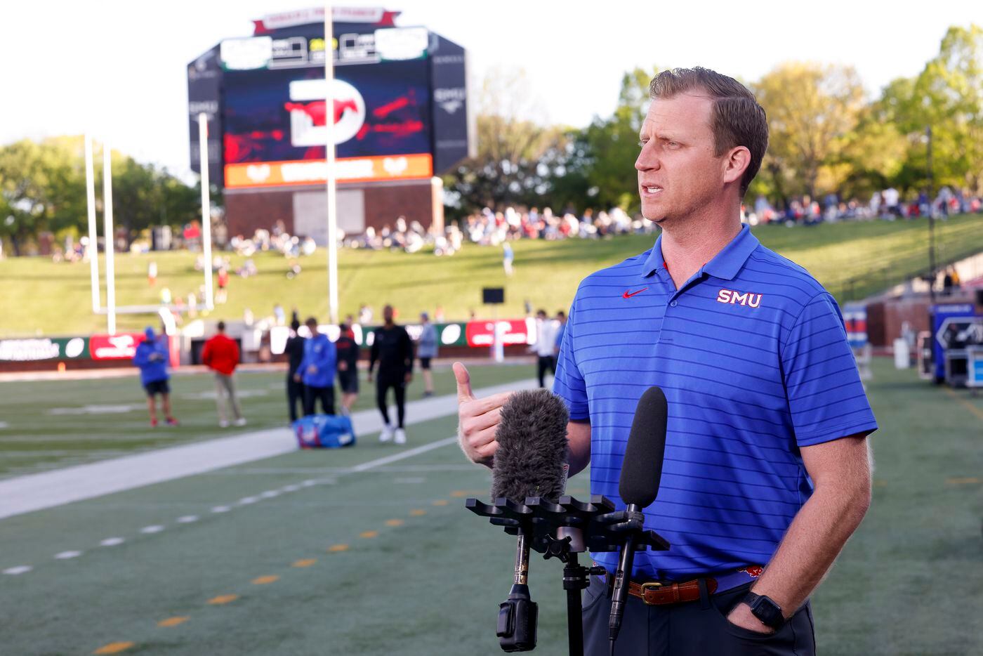 Coach Rhett Lashlee speaks to reporters before the SMU Football annual spring game at Gerald...