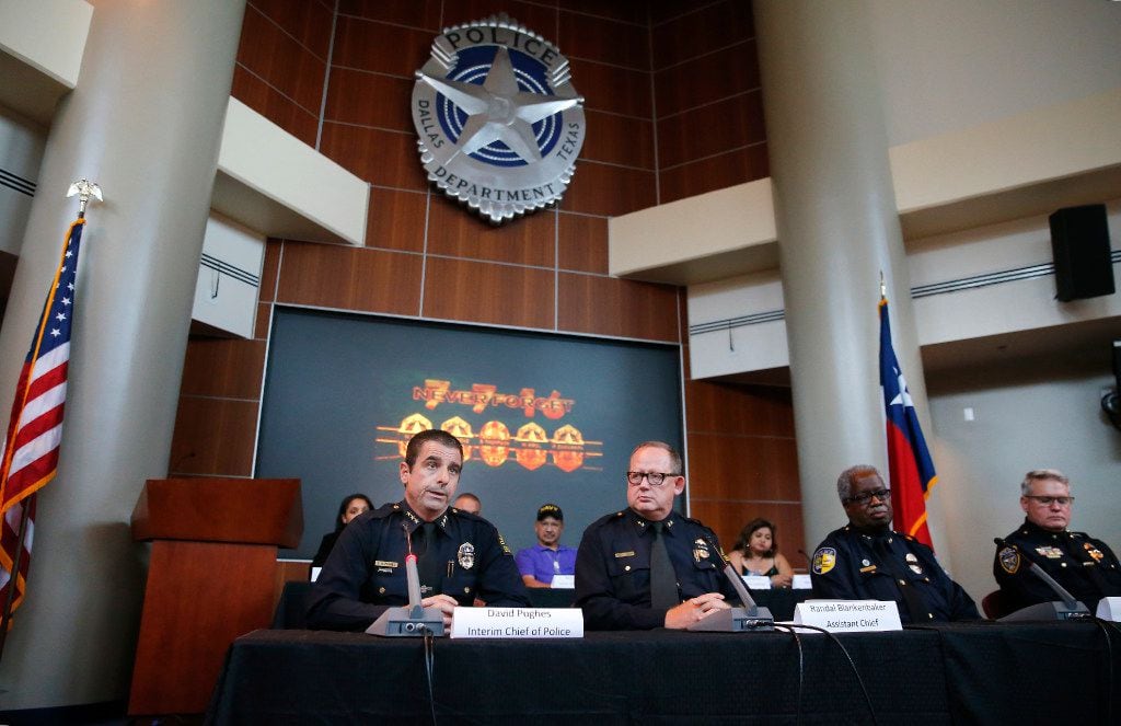 Interim Dallas Police Chief David Pughes (left) speaks alongside Assistant Chief Randal...