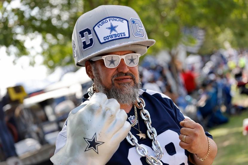 A Dallas Cowboys fan poses for a photo as he tailgates before the first half of a NFL...