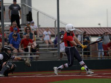 Allen High School player #10, Alexis Telford, hits a foul during a softball playoff game...