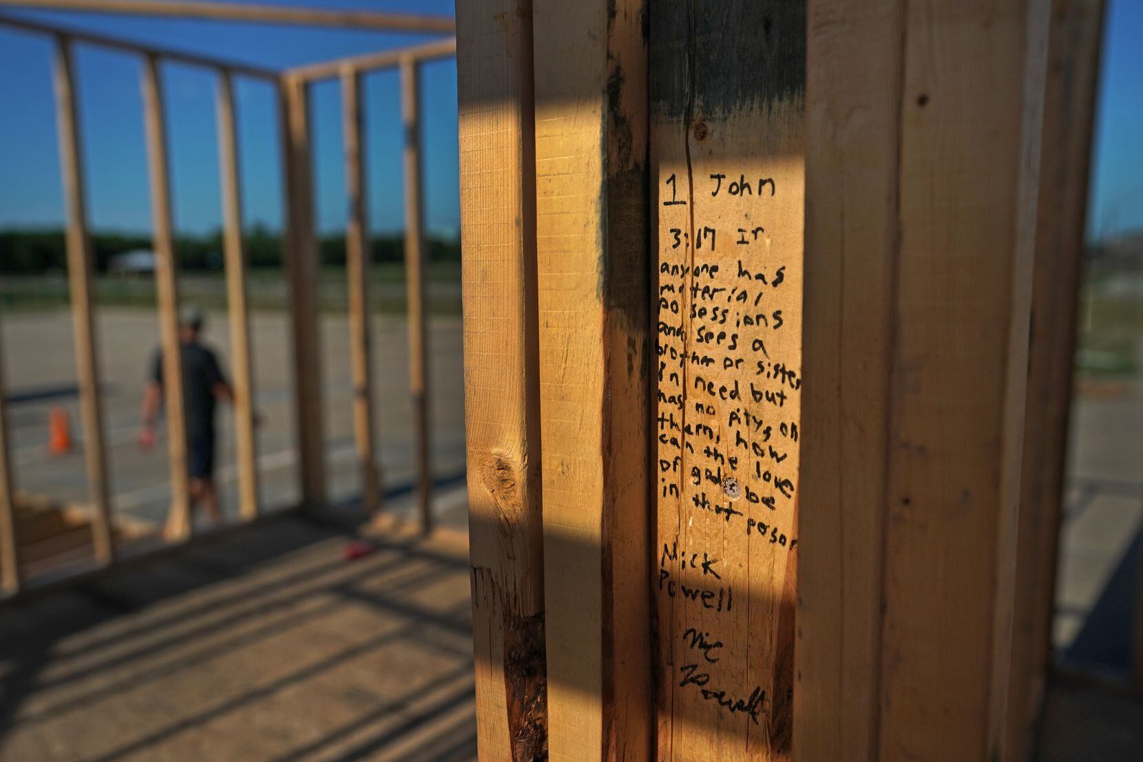 A Bible verse was written on lumber at the parking-lot construction site at Cottonwood Creek Church in Allen.