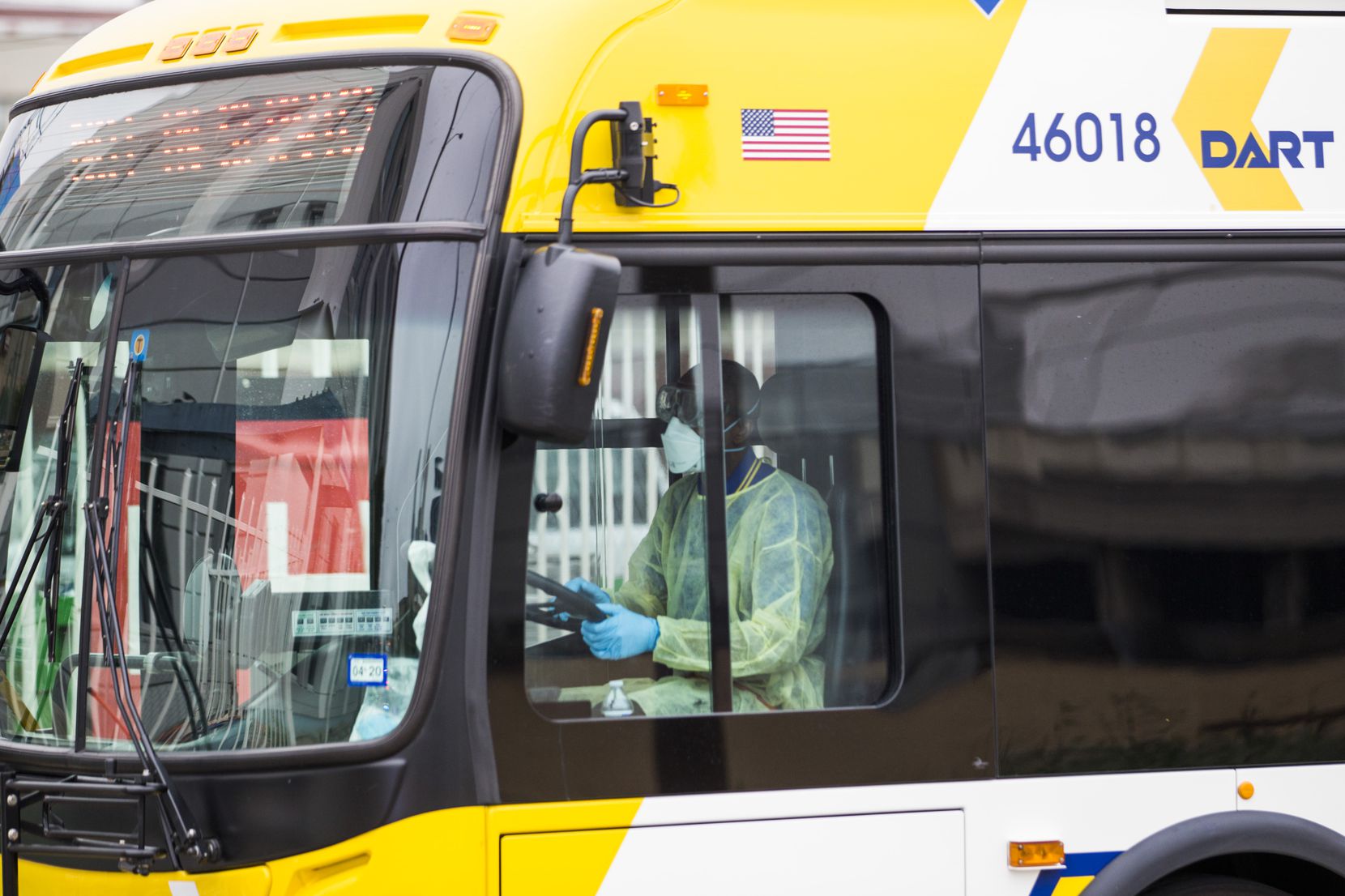A DART bus driver was dressed in protective gear as he transported people away from Dallas...