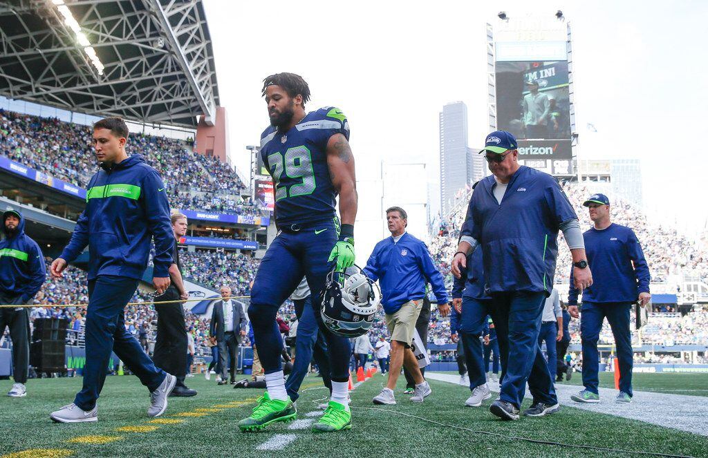 FILE - Seahawks safety Earl Thomas (29) walks back to the locker room during the first half...