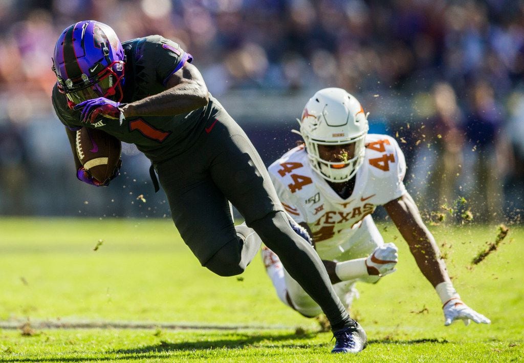 FILE - TCU wide receiver Jalen Reagor (1) escapes a tackle by Texas defensive back Tyler...