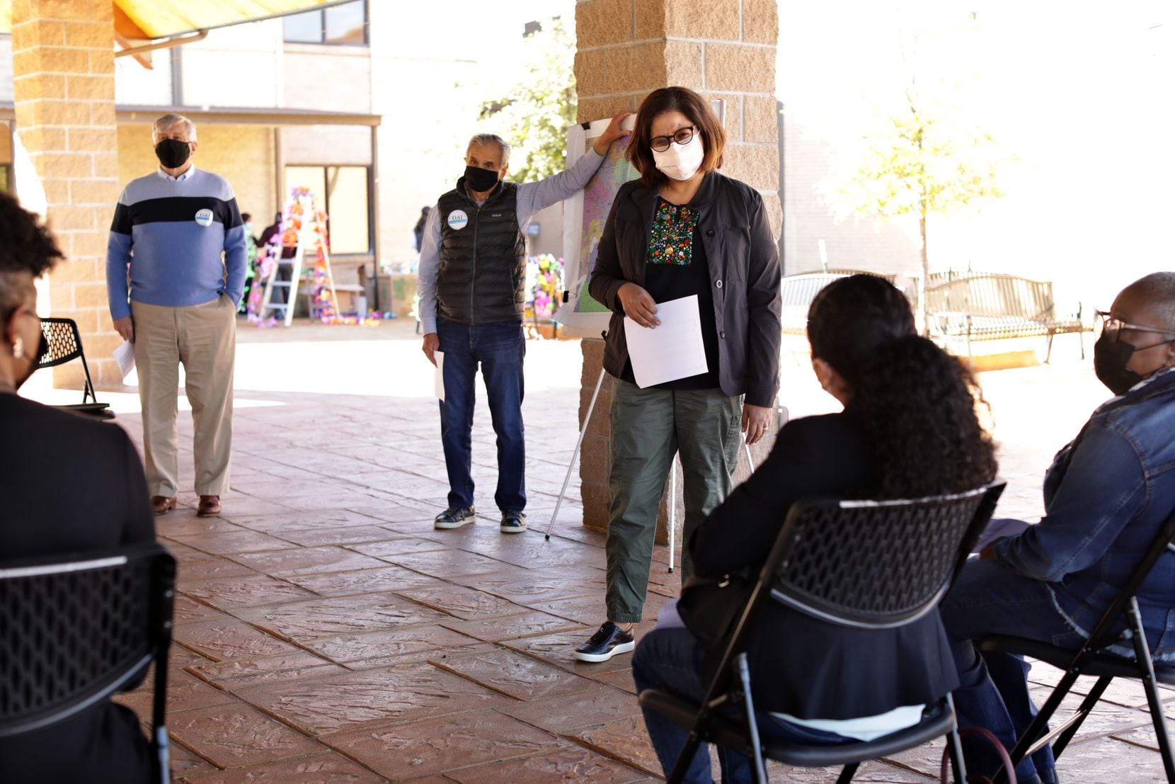 Josephine Lopez Paul, center, speaks to volunteers during a Dallas Area Interfaith meeting...