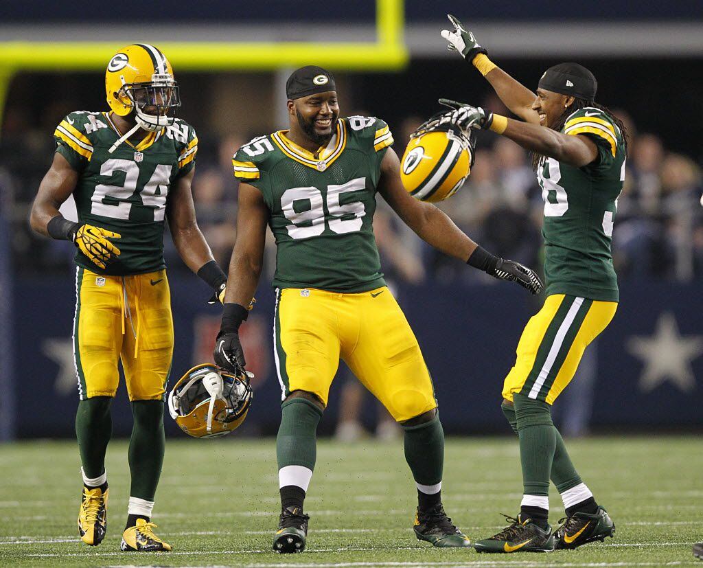 Green Bay Packers cornerback Tramon Williams (38) celebrates his fourth quarter interception...