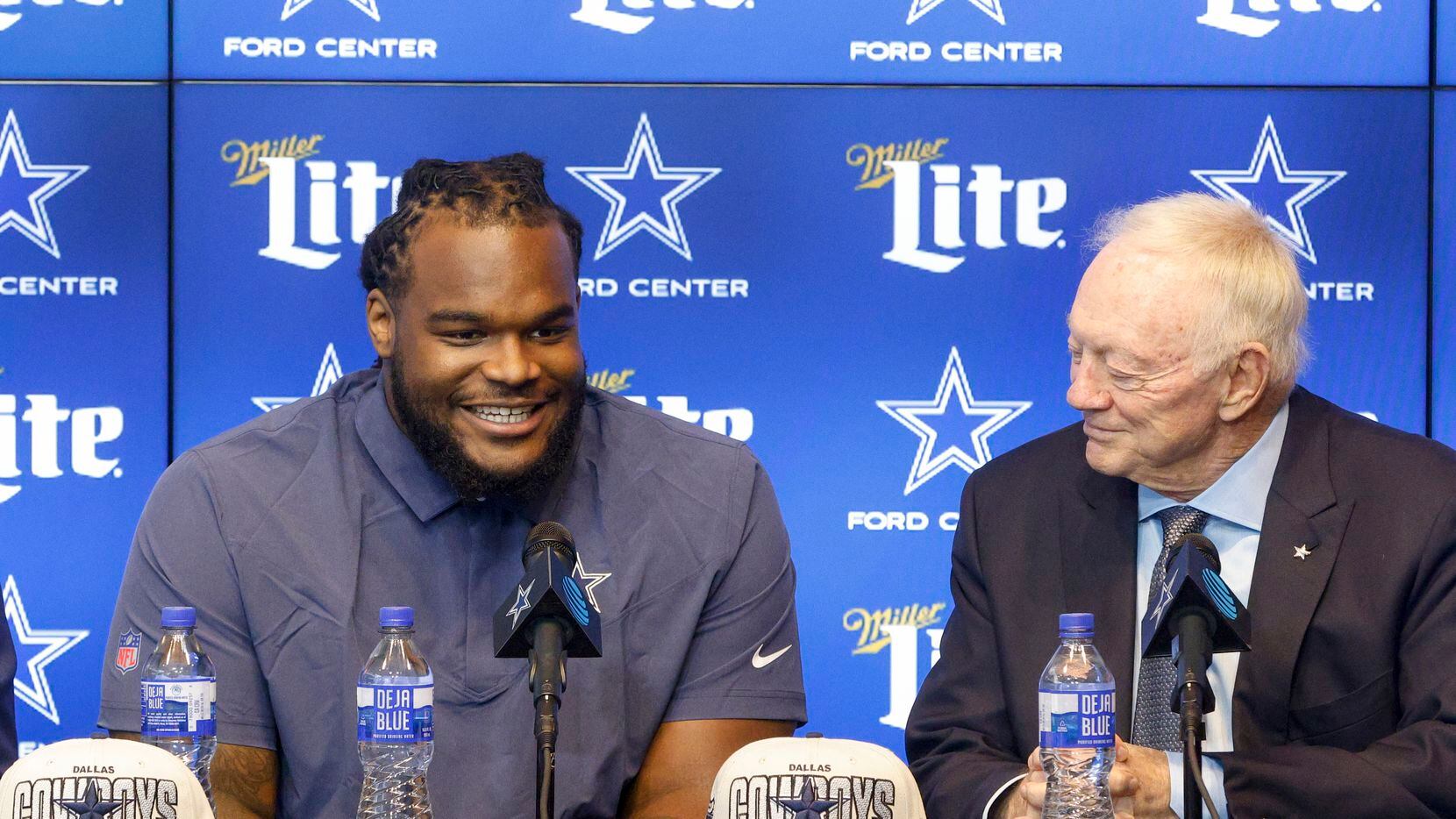 Dallas Cowboys rookie defensive tackle Mazi Smith smiles as he answers a question next to...