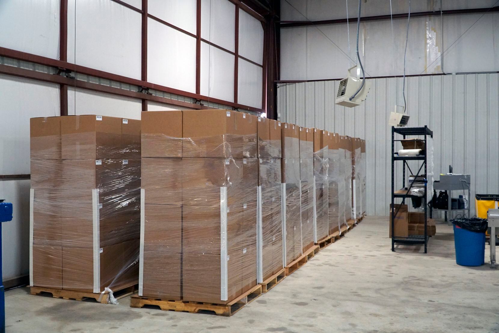 Over 200,000 masks are boxed and ready for shipment at United States Mask Co. in Fort Worth,...