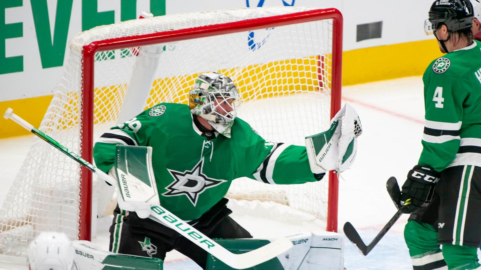 Dallas Stars goaltender Jake Oettinger (29) makes a save during the second period of a...